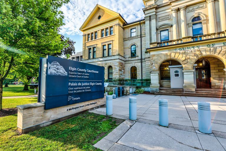Elgin County Courthouse sign at 4 Wellington Street beside the arched stone entrance.