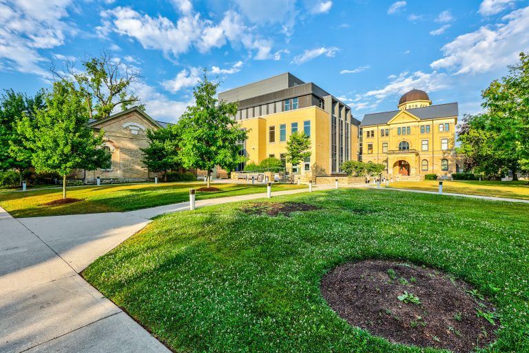 Walkway and lawn leading to the courthouse and its modern addition.